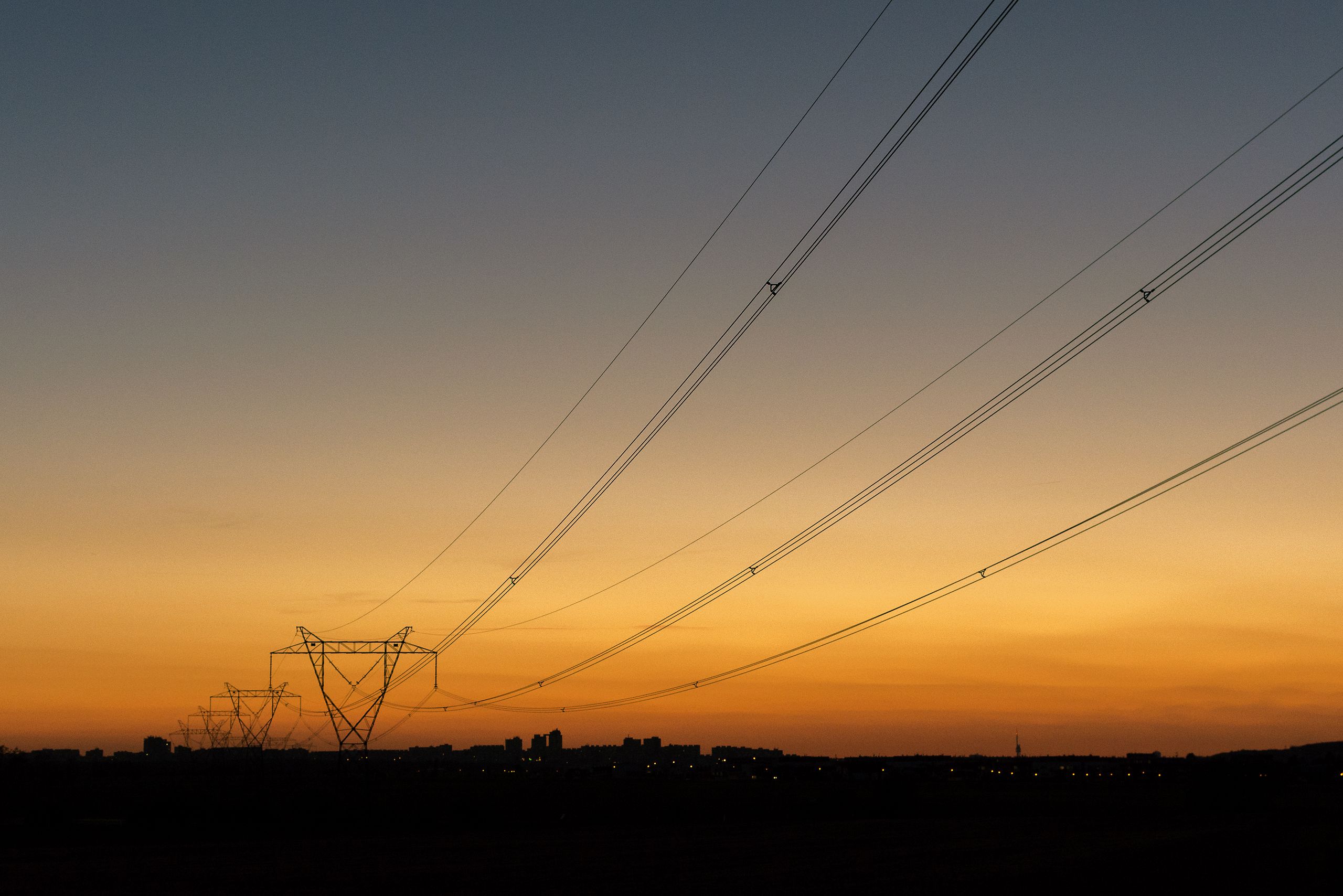 High voltage transmission infrastructure at dusk